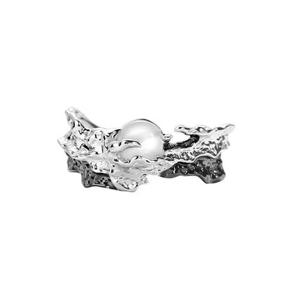 Silver ring with a pearl on a white background